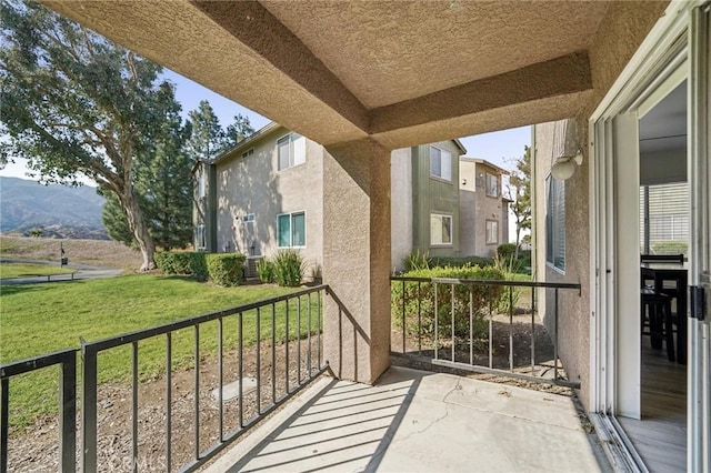 balcony featuring a mountain view