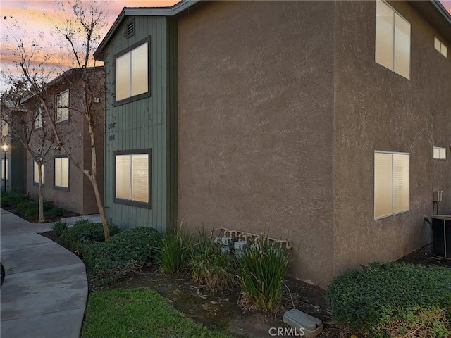 view of property exterior at dusk