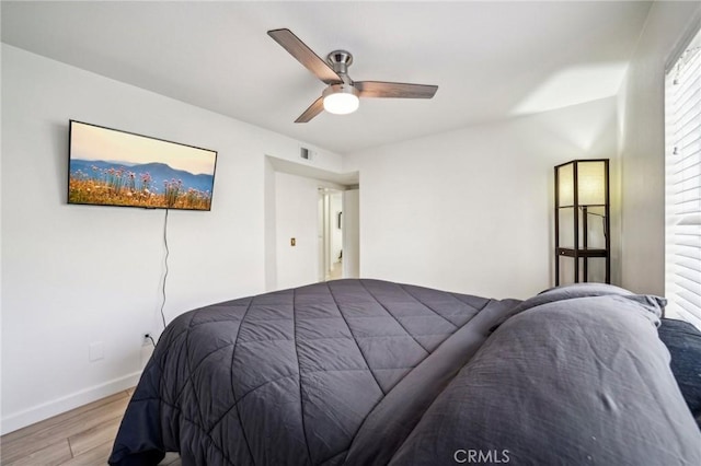 bedroom featuring ceiling fan and light wood-type flooring