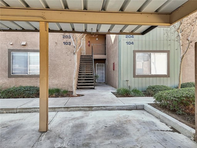 property entrance featuring a patio