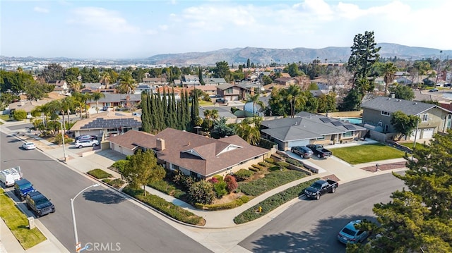 birds eye view of property featuring a mountain view