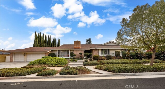 ranch-style home featuring a garage