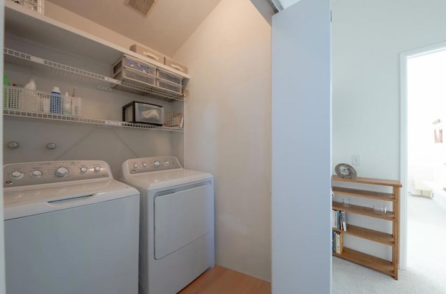 laundry area with independent washer and dryer