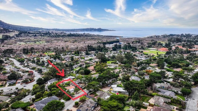 birds eye view of property featuring a water view