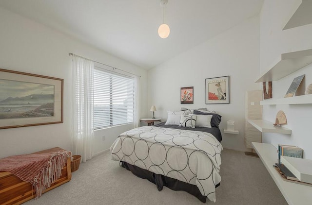 carpeted bedroom featuring lofted ceiling