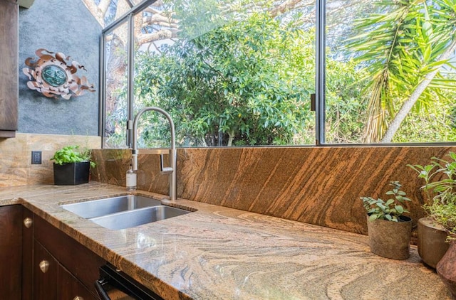 interior space featuring sink and black dishwasher