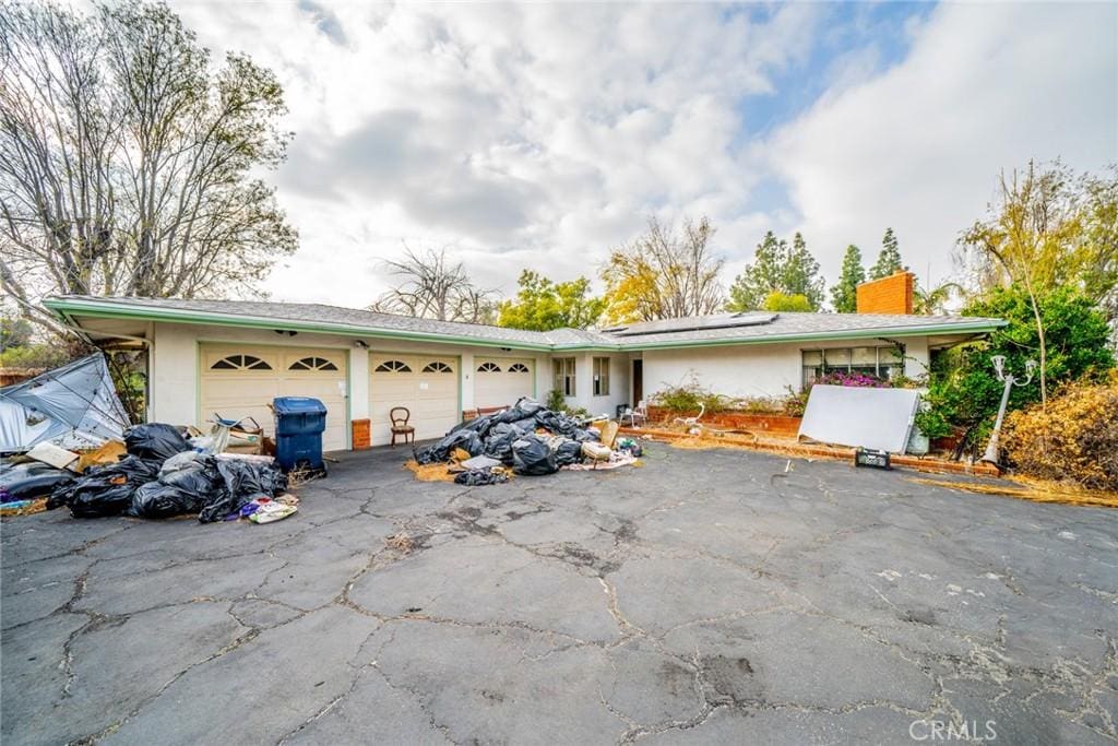 single story home with a garage