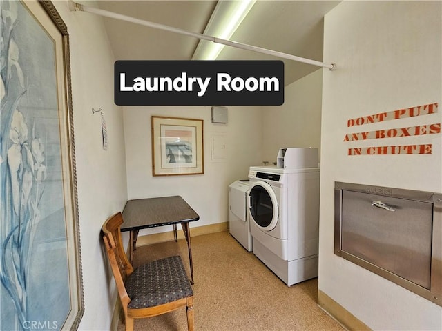 clothes washing area with washer and dryer