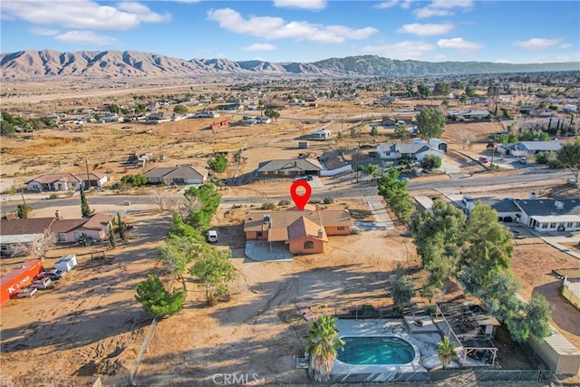 birds eye view of property featuring a mountain view