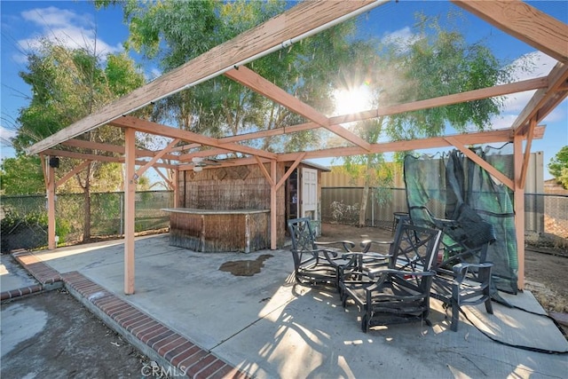 view of patio featuring a storage unit