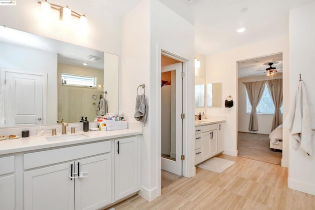 bathroom featuring ceiling fan and vanity