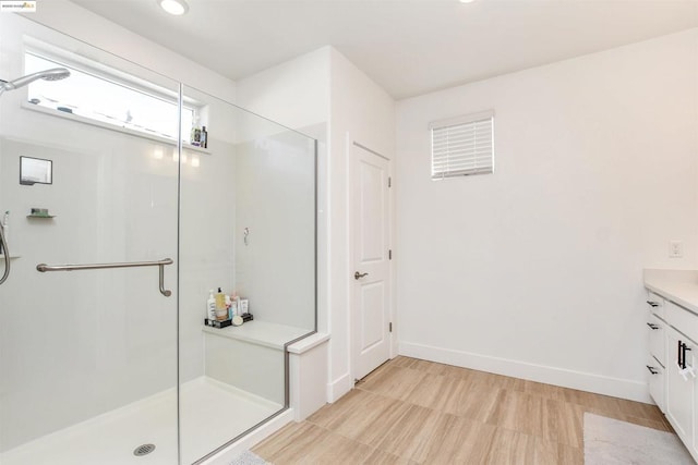 bathroom with vanity and an enclosed shower