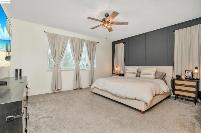 bedroom with ceiling fan and carpet flooring