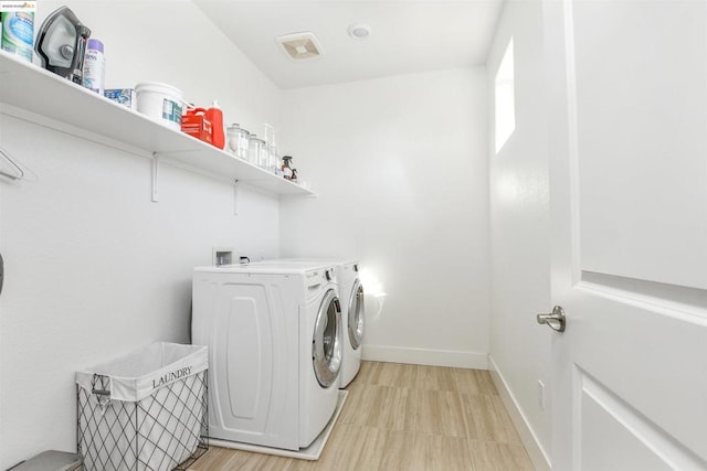 laundry room with washing machine and dryer