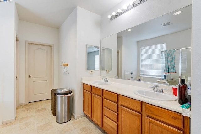 bathroom with vanity and walk in shower