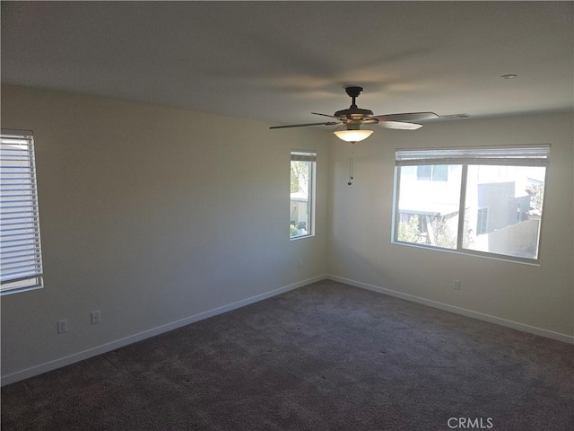 carpeted empty room featuring ceiling fan