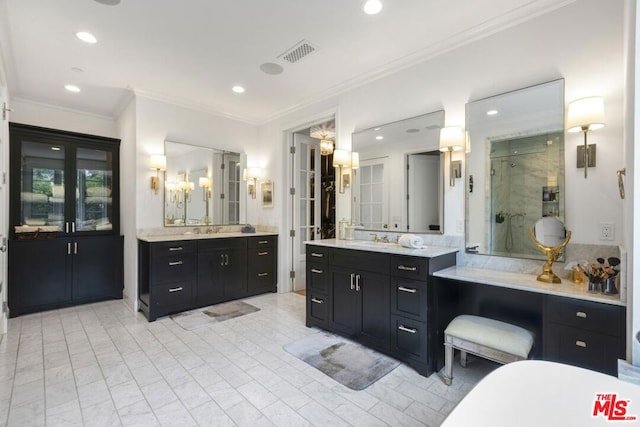 bathroom featuring vanity, crown molding, and walk in shower