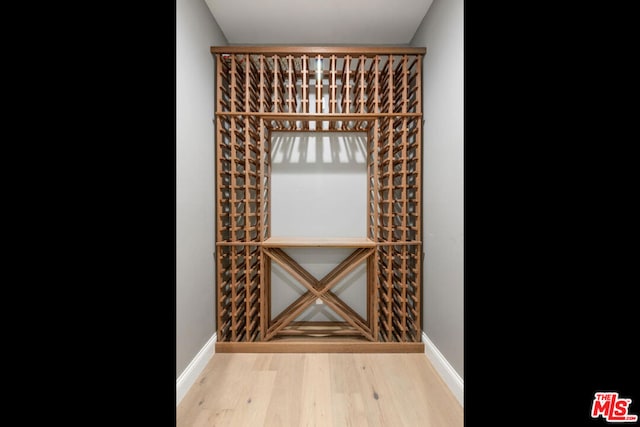 wine room with light hardwood / wood-style flooring