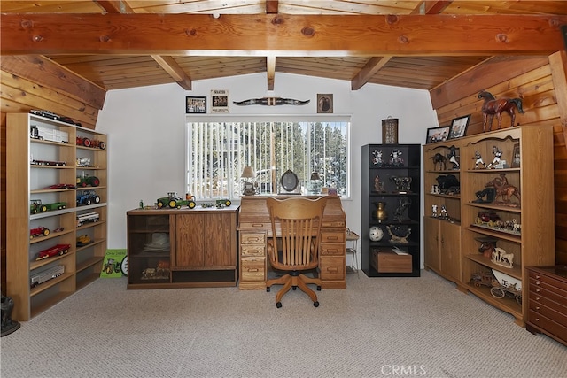 office area with vaulted ceiling with beams, wooden walls, and light colored carpet