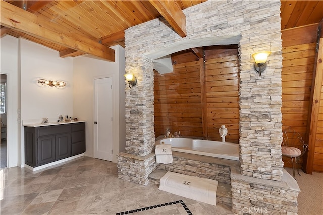 bathroom with vanity, wood ceiling, a tub, and beamed ceiling