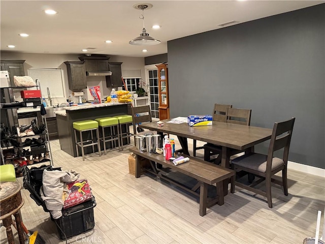 dining room with light hardwood / wood-style flooring