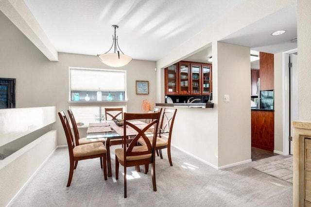 view of carpeted dining area