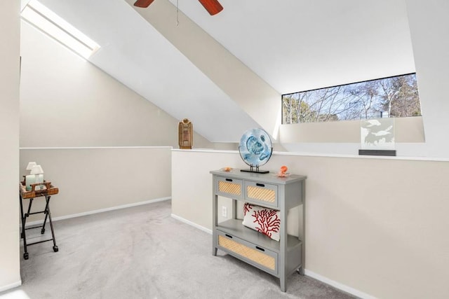 additional living space featuring lofted ceiling, light colored carpet, and ceiling fan