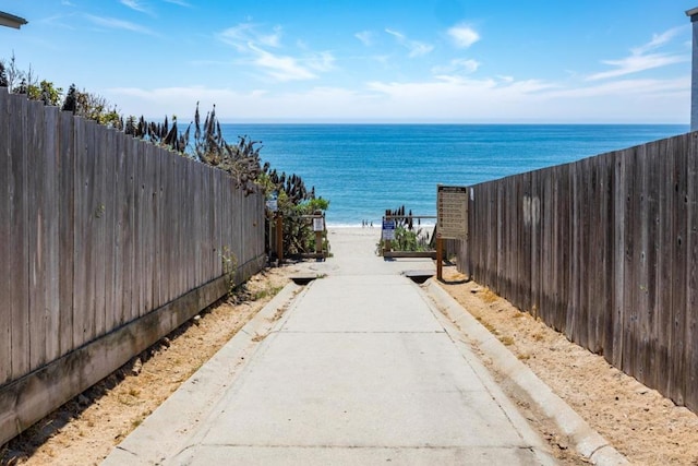 property view of water featuring a beach view