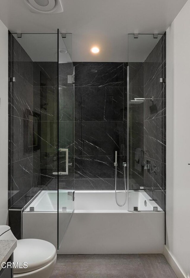 full bathroom with vanity, toilet, and tiled shower / bath combo