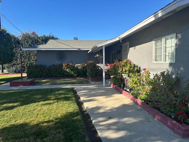 view of home's exterior featuring a yard