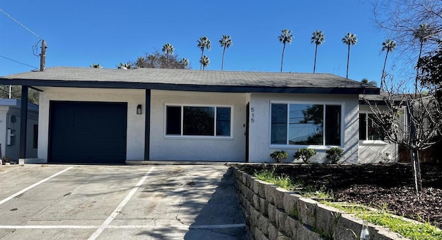 ranch-style home featuring a garage