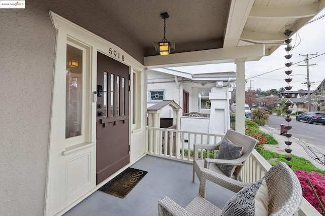 property entrance featuring covered porch