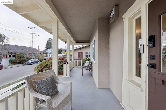 balcony featuring a porch