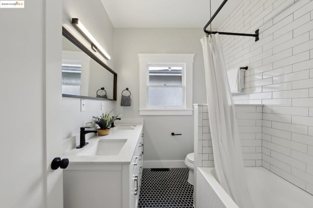 full bathroom with vanity, shower / bath combination with curtain, and toilet