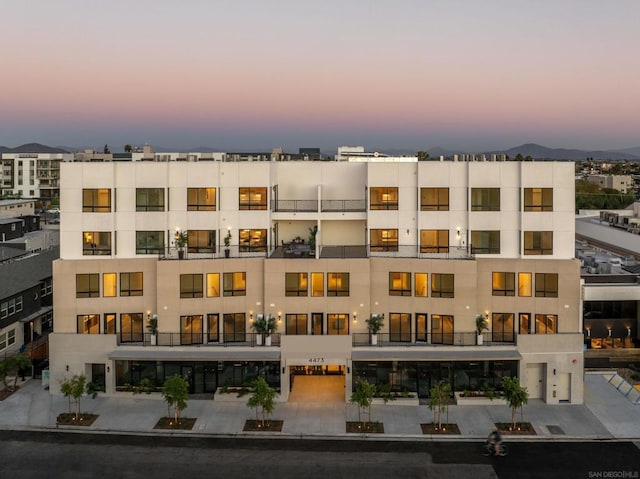 outdoor building at dusk featuring a mountain view