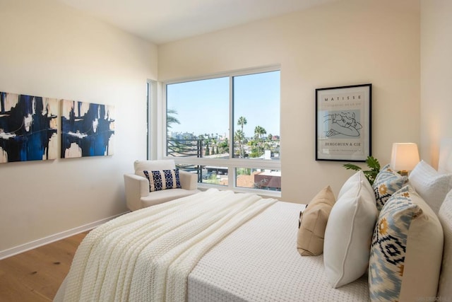 bedroom with hardwood / wood-style floors