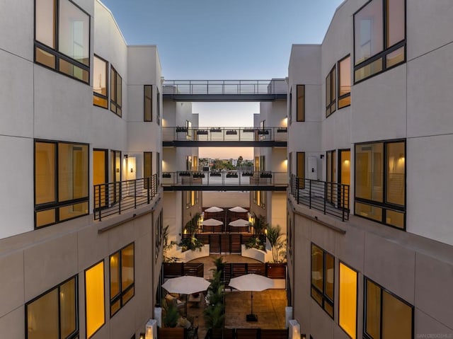 view of balcony at dusk