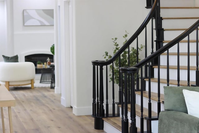 stairs with hardwood / wood-style floors