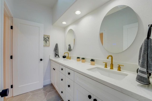 bathroom featuring tile patterned flooring and vanity