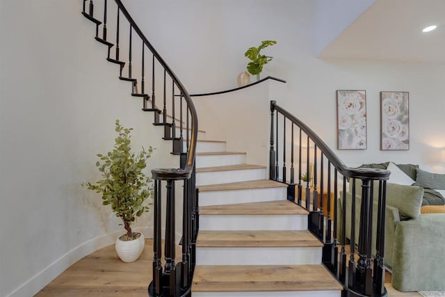 stairway with wood-type flooring