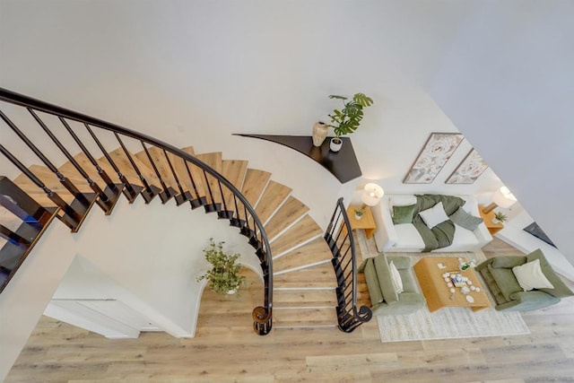 staircase featuring wood-type flooring