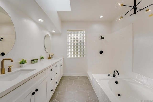 bathroom featuring vanity, independent shower and bath, and tile patterned flooring