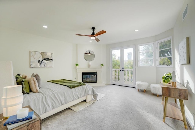 bedroom featuring french doors, ceiling fan, access to exterior, and carpet