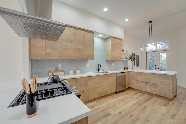 kitchen with sink, exhaust hood, hanging light fixtures, and light brown cabinets