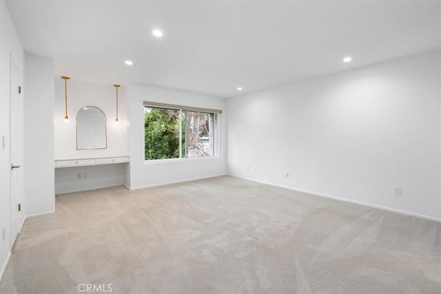 unfurnished bedroom with light colored carpet