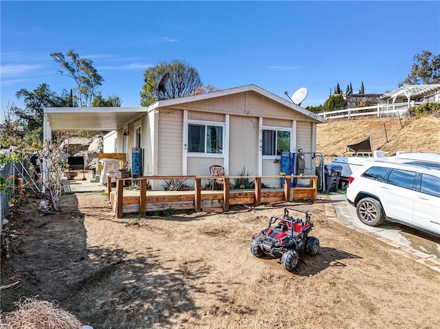 view of front of property with a carport