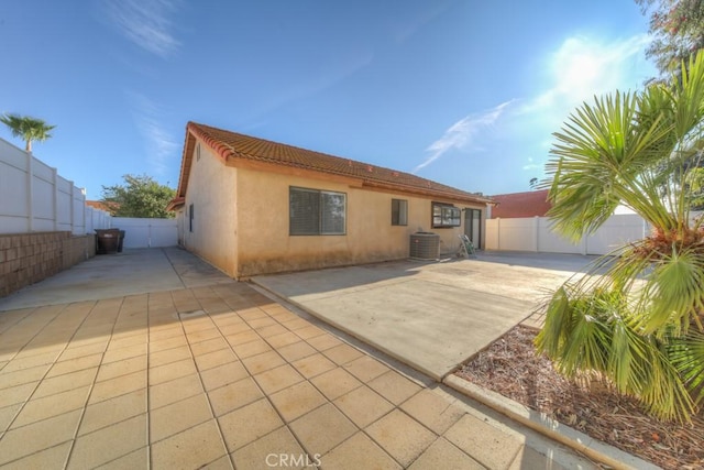 view of front of home featuring a patio and central AC