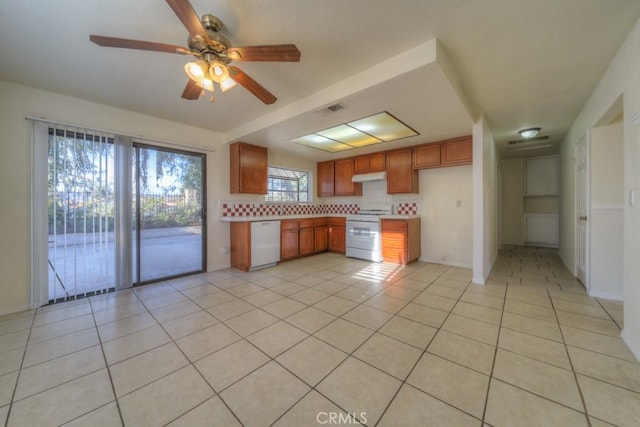 kitchen with light tile patterned flooring, white appliances, ceiling fan, and backsplash