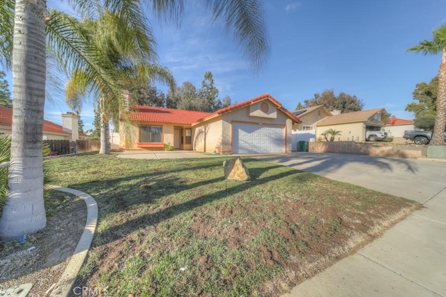 view of front of house with a garage and a front lawn