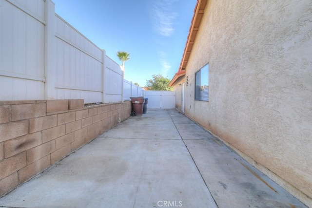 view of property exterior with a patio